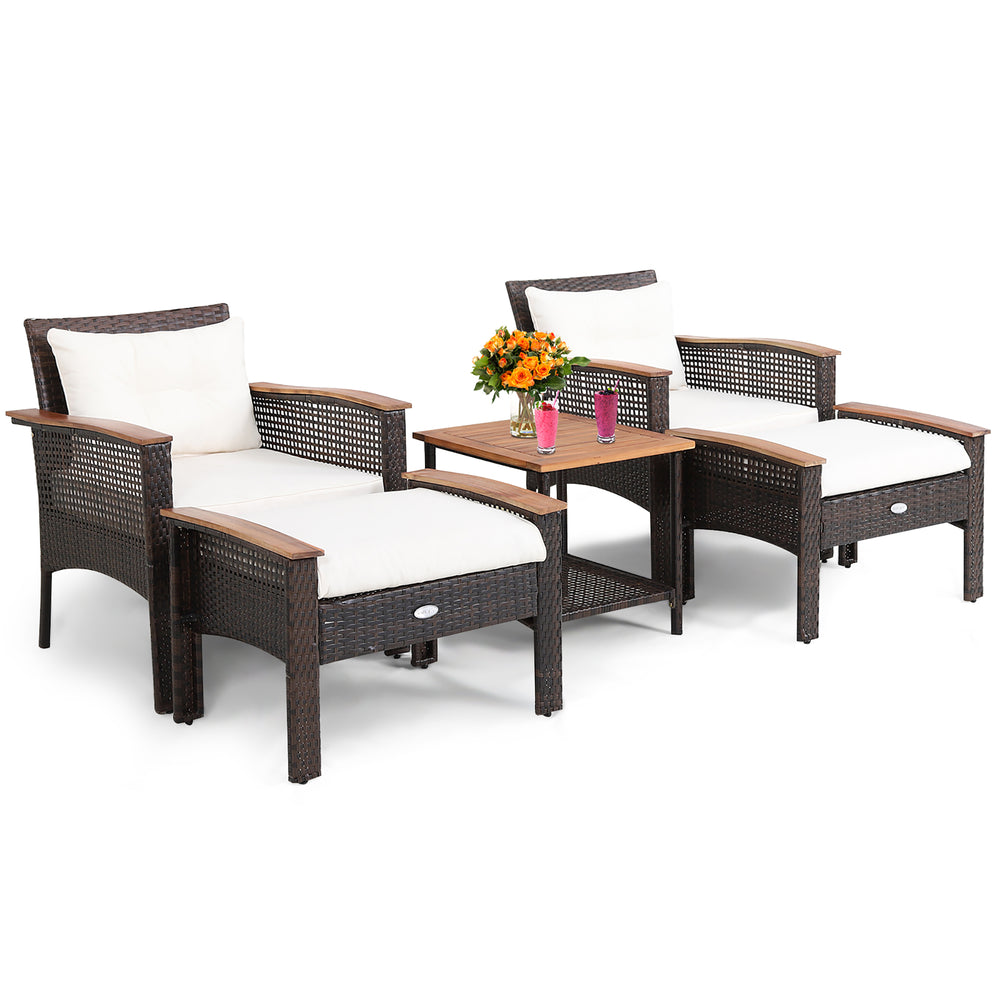 5-piece patio rattan furniture set featuring 2 ergonomic chairs, 2 ottomans, and an acacia wood coffee table for.