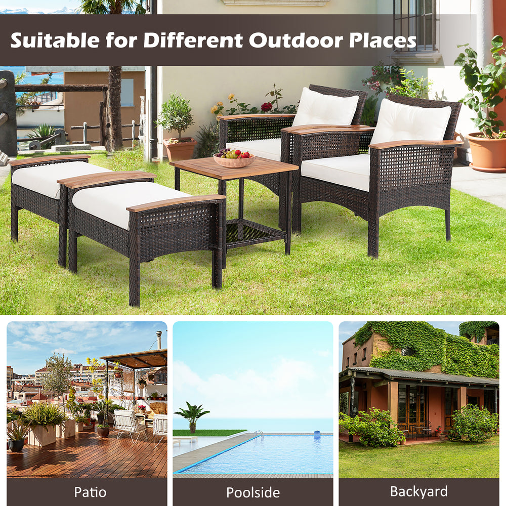 5-piece patio rattan furniture set with acacia wood table, featuring 2 chairs and 2 ottomans for outdoor relaxation.
