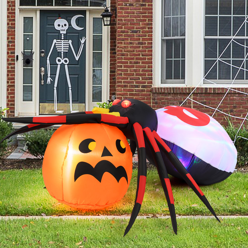 Inflatable spider with pumpkin and rotating light, 4.9 x 4.6 feet, perfect for Halloween backyard decoration.