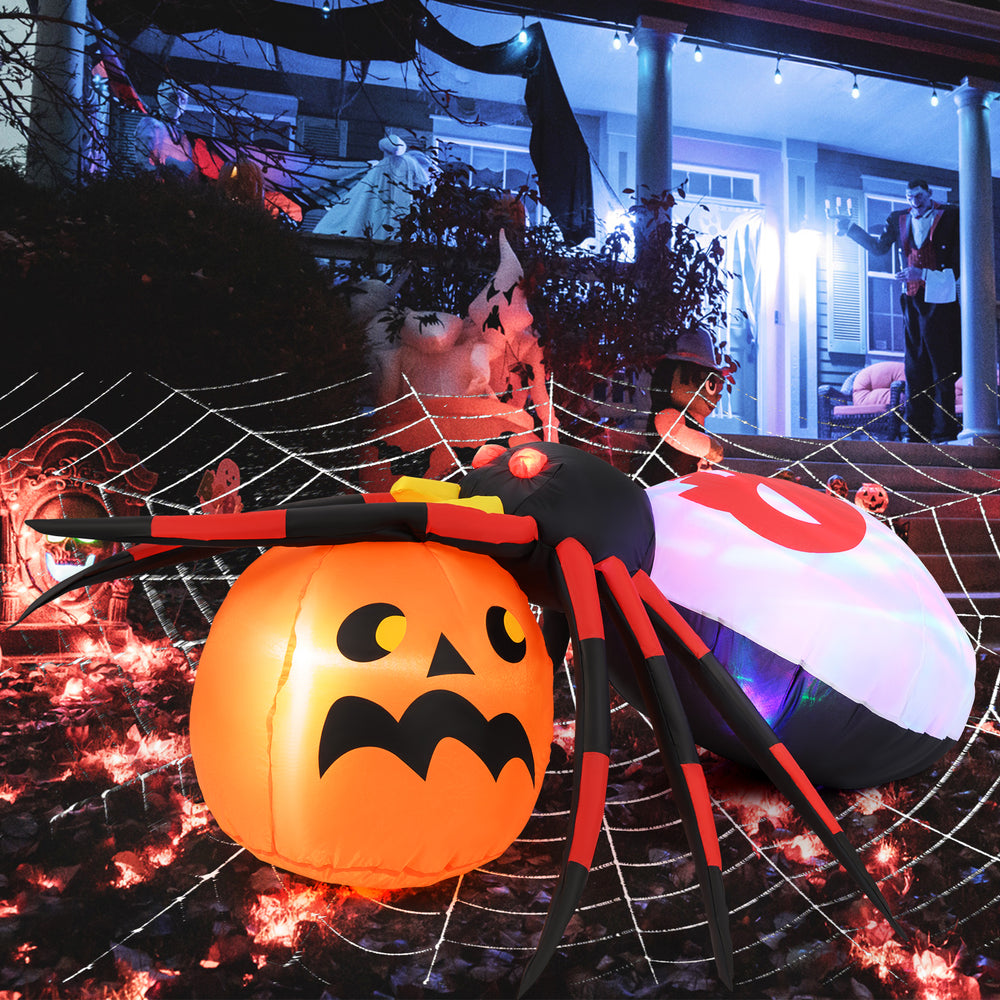 Inflatable spider and pumpkin decoration with colorful rotating lights, perfect for Halloween backyard displays.