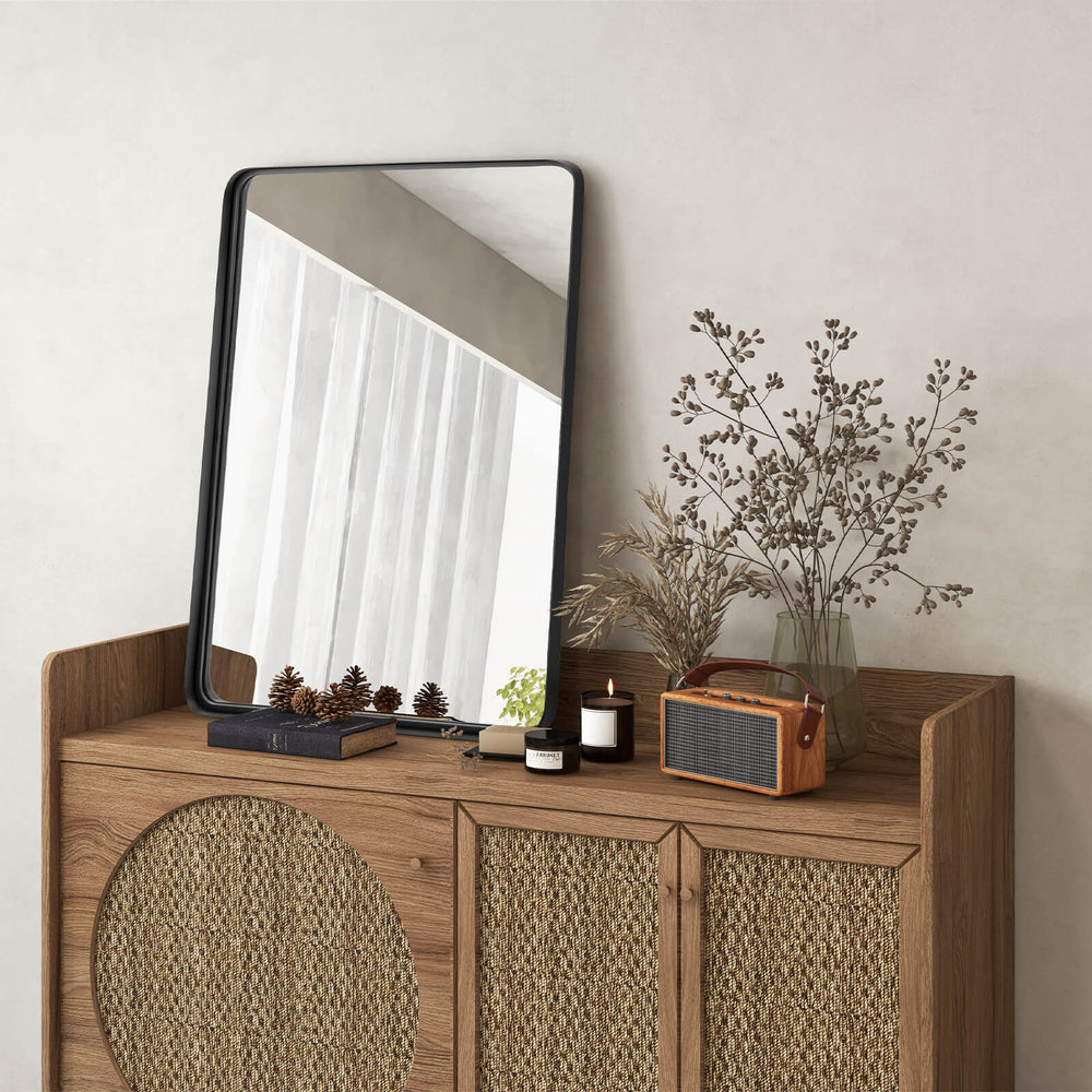 Rectangular wall mount bathroom mirror with rust-resistant steel frame, displayed on a wooden cabinet for versatile.