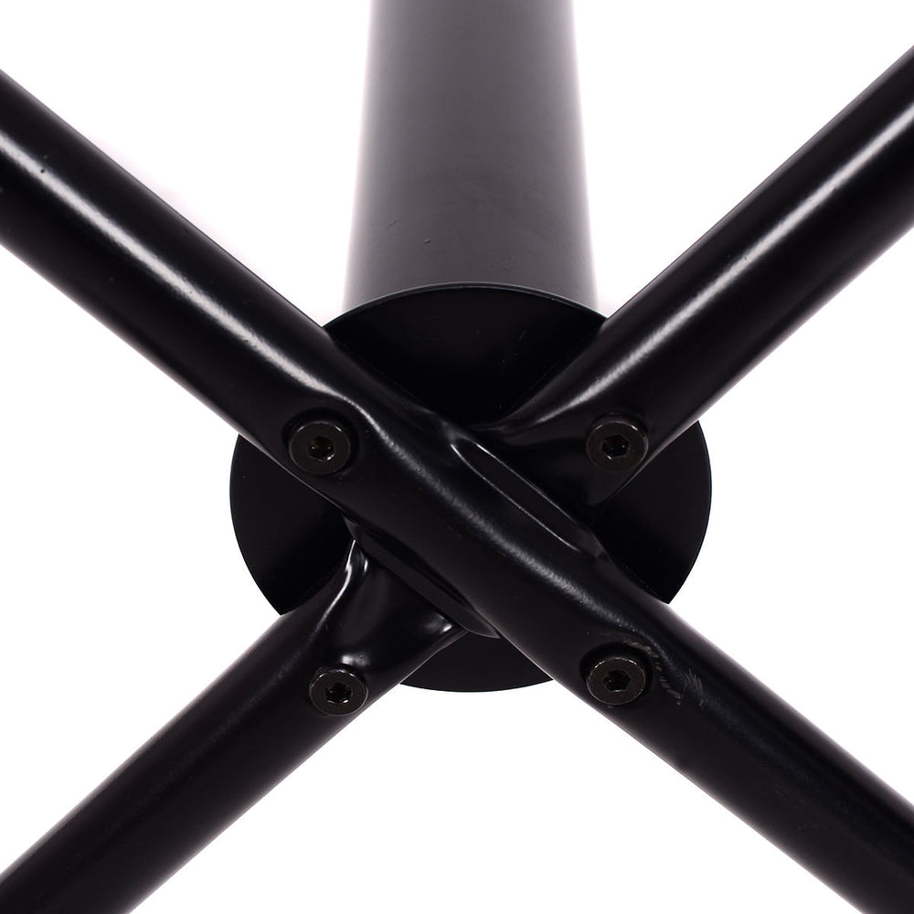 Close-up of the sturdy black metal base of a coat rack with a premium powder-coated finish and cross support design.