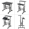 Mobile stand-up computer desk in black with adjustable height and tilting desktops, ideal for small spaces and.