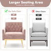 Modern velvet accent chair in pink with button tufted back, wider seating area, and golden metal legs for added.