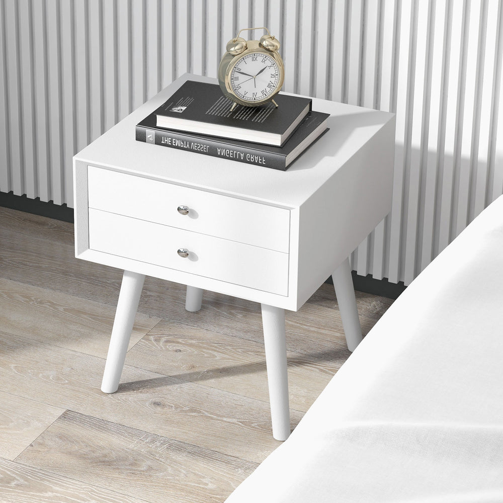 White wooden nightstand with a clean design, featuring a solid tabletop for decor and two drawers for efficient storage.