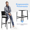 Bar stool with ergonomic footrests and soft padded cushions, featuring a sturdy steel frame and modern PE wicker design.