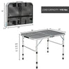 Folding aluminum grill table with iron mesh top, adjustable height, and compact design for outdoor camping and BBQ use.