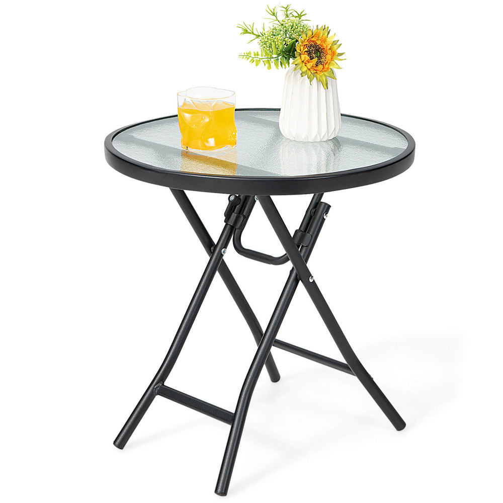 Round patio side table with tempered glass tabletop, rustproof steel frame, and folding design for easy storage.