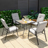 Patio dining set with stackable cushioned chairs and tempered glass tabletop, perfect for outdoor relaxation.