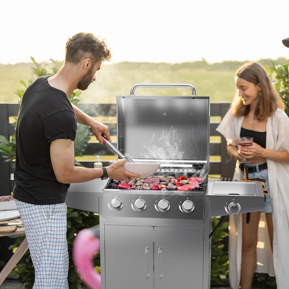 Stainless steel 5-burner propane gas grill with side burner, featuring two prep tables for convenient outdoor cooking.