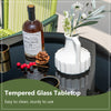 Round bistro table with tempered glass tabletop, featuring a sturdy metal frame, perfect for backyard or poolside use.