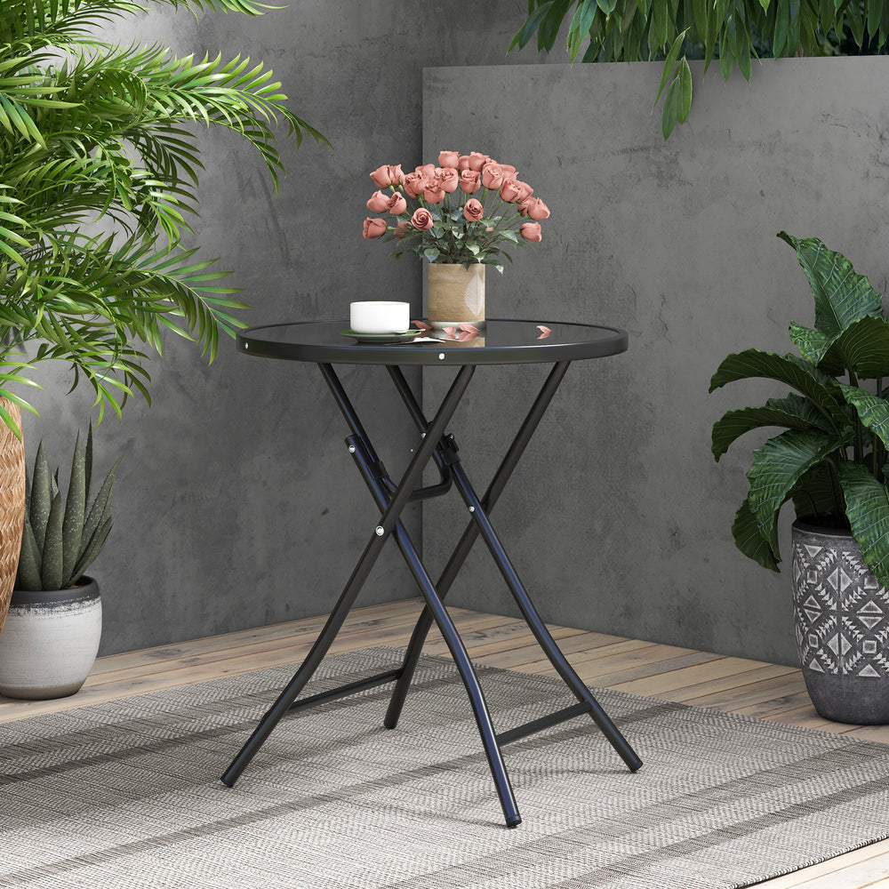 Round bistro table with tempered glass tabletop and heavy-duty metal frame, perfect for backyard or poolside use.