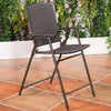 Folding rattan bar chair viewed from the side, featuring a lightweight steel frame and comfortable footrest for.
