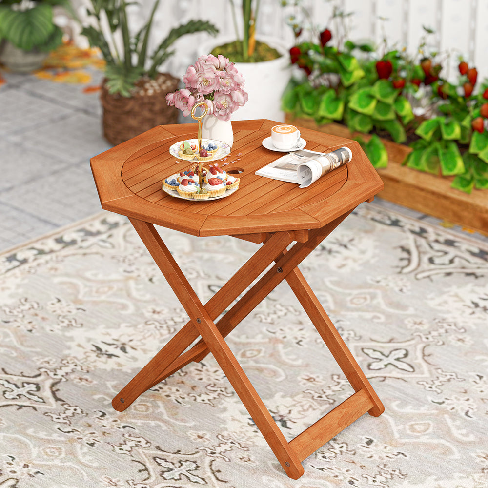 Octagon folding patio table in teak finish with 2" umbrella hole, perfect for outdoor gatherings on the balcony or.