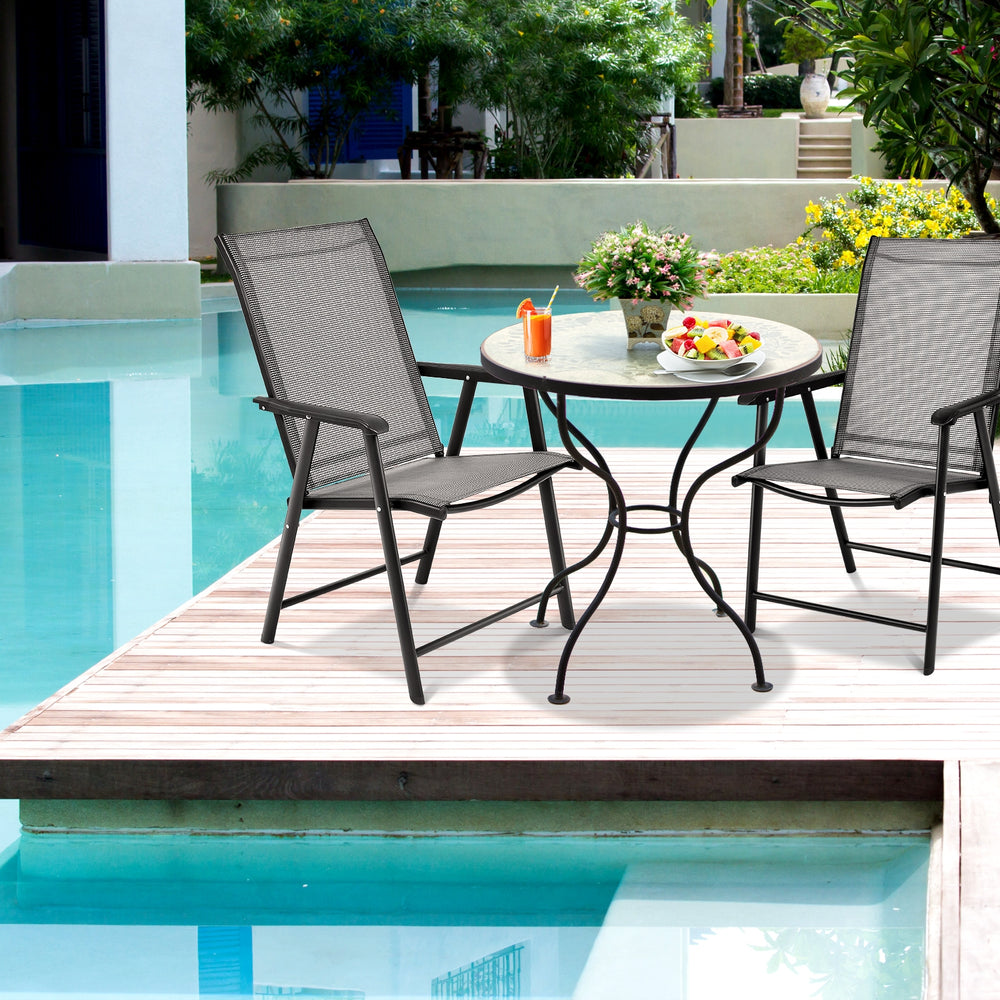 Gray folding patio chairs with steel frames, perfect for outdoor camping and gatherings by the poolside.