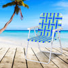 Folding beach chair with blue webbing, featuring a sturdy steel frame, ideal for camping and outdoor relaxation.