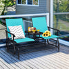 Double rocking loveseat in turquoise with tempered glass table, perfect for outdoor relaxation on the patio.