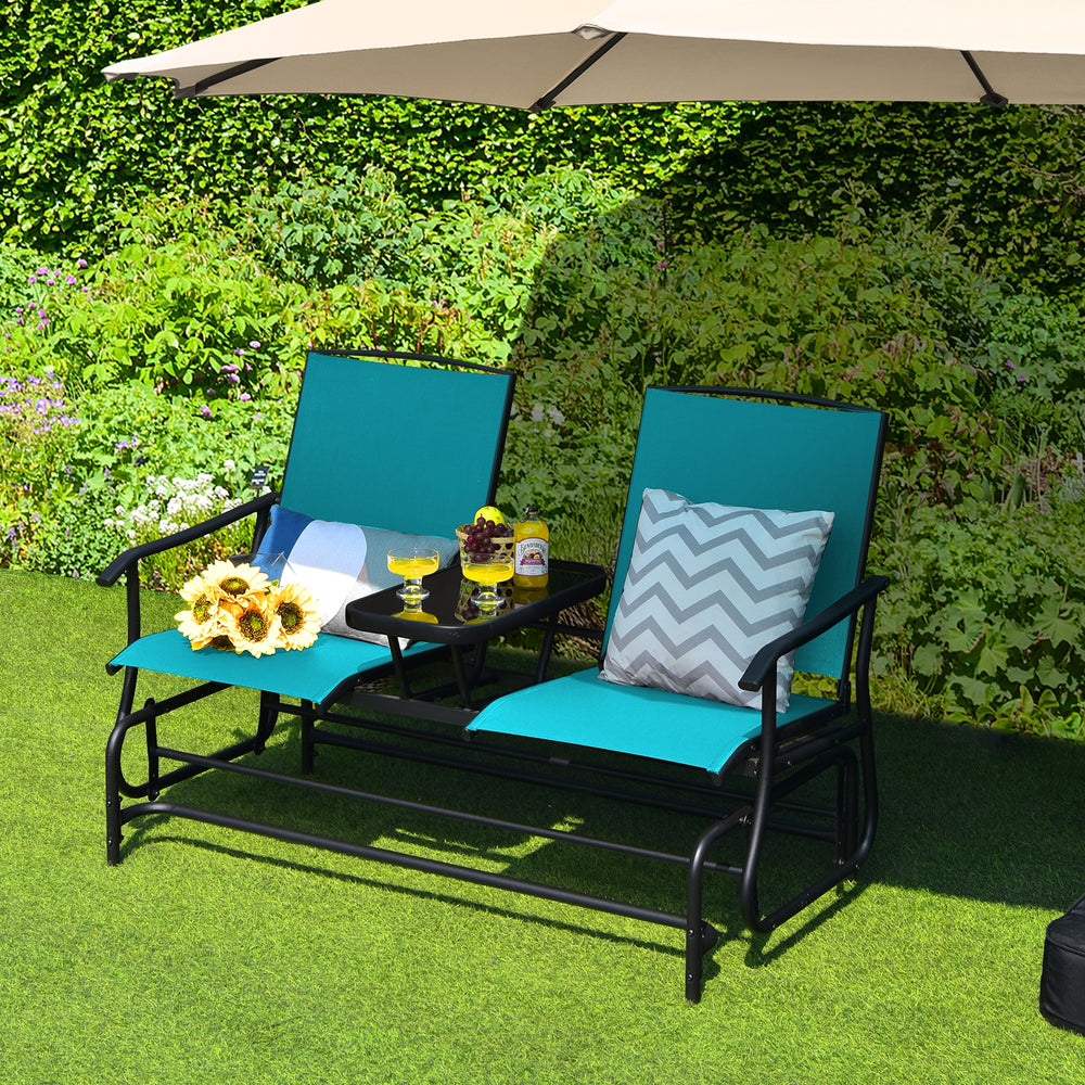 Double rocking loveseat in turquoise with tempered glass table, perfect for outdoor relaxation and leisure.
