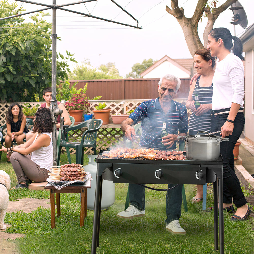 Portable propane 3 burner gas cooker with sturdy cast iron design, perfect for outdoor cooking and gatherings.