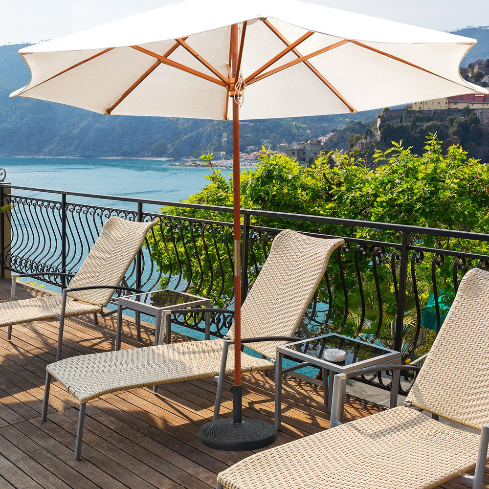 Patio resin umbrella base stand weighing 49 lbs, designed for stability with freestanding umbrellas or patio tables.