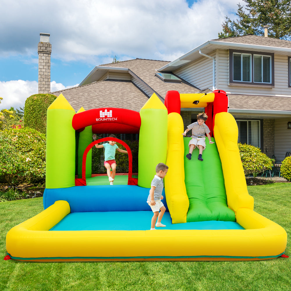 Outdoor inflatable bounce house with slide and bright colors, suitable for gardens and parks, made of durable Oxford.