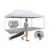 Pop-up patio canopy tent in white, featuring a heavy-duty metal frame and easy setup, ideal for outdoor gatherings.