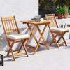 Outdoor wood bistro set featuring a folding table and two chairs with soft seat cushions, perfect for backyard.
