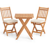 Acacia wood bistro table with slatted design, paired with two high-back chairs and soft cushions, perfect for outdoor.