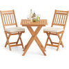 Outdoor acacia wood bistro set with soft seat cushions, featuring a folding table and high-back chairs for backyard.