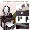Close-up of the elegant crystal drawer knob on the brown oval mirror vanity set, enhancing its stylish design and.