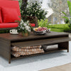 Patio wicker daybed with adjustable backrest, soft cushions, and storage ottoman, perfect for outdoor relaxation.
