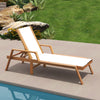 Patio chaise lounge chair with white fabric seat, acacia wood frame, and adjustable backrest for poolside relaxation.