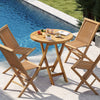 Teak wood dining table with slatted top and X-shaped frame, perfect for outdoor patio gatherings by the poolside.