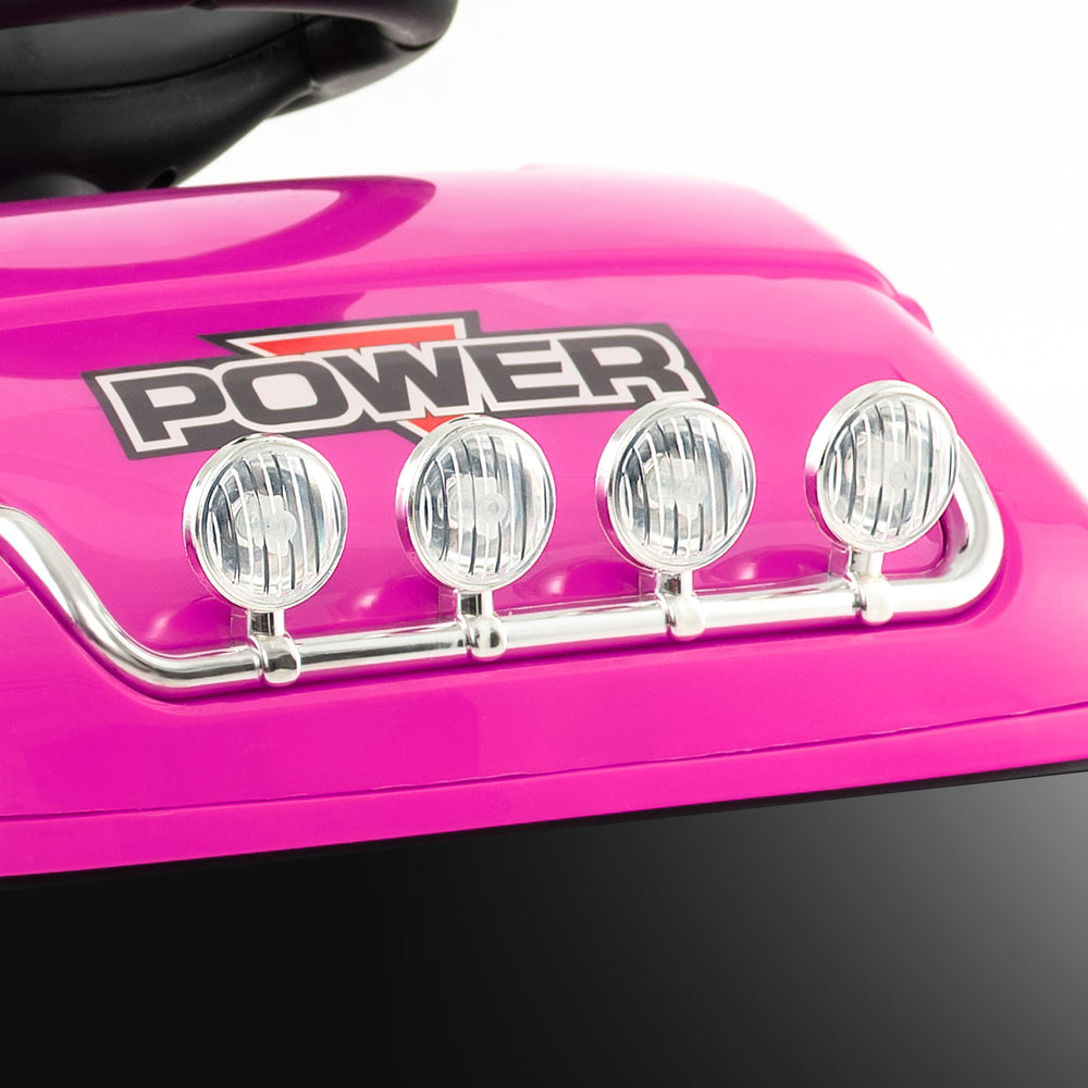 Close-up of the pink 6V kids electric ride-on truck's decorative LED lights and power logo for fun and safety.