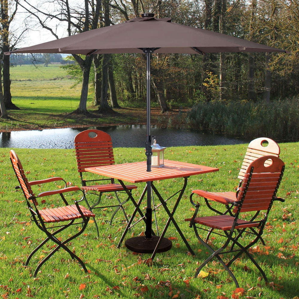 9FT tan patio solar umbrella with LED lights, steel tilt and crank, ideal for outdoor dining and relaxation.