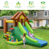Inflatable jungle bounce house with slides and climbing wall, made of puncture-resistant PVC fabric, for outdoor fun.