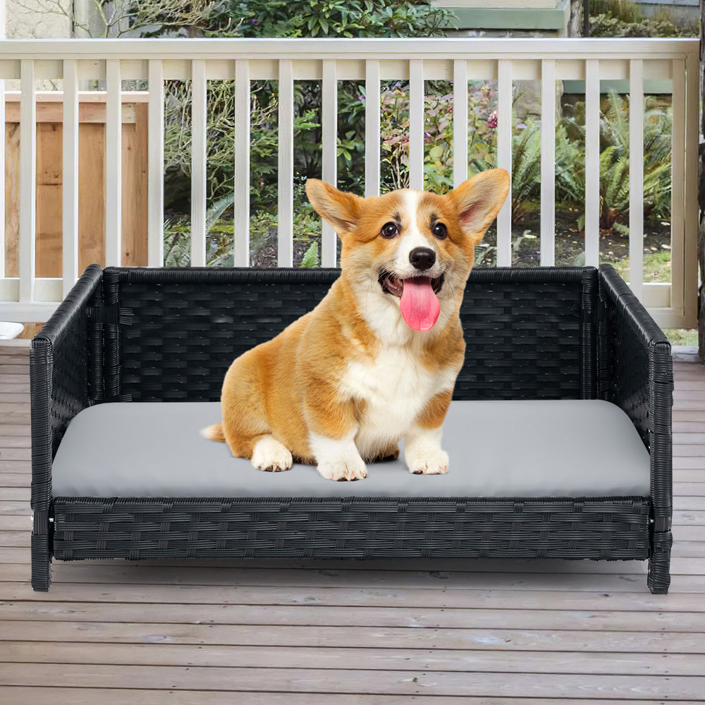 Rattan dog bed with waterproof cushion for medium small pets, featuring a cozy design for indoor and outdoor use.