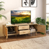 Rattan TV stand with solid wood legs, dual drawers, and cabinets, perfect for 65-inch TVs in a stylish living room.