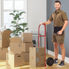 P-handle sack truck with 10-inch wheels, shown in use for moving boxes, featuring a foldable load area for easy storage.