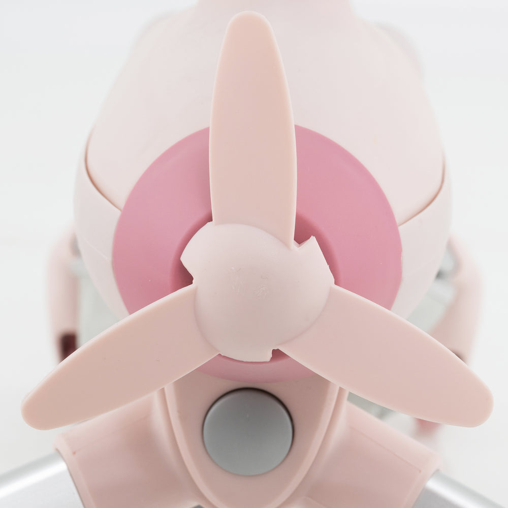 Close-up of the pink propeller on the 2-in-1 kids ride-on push car with LED lighted wheels for fun outdoor play.