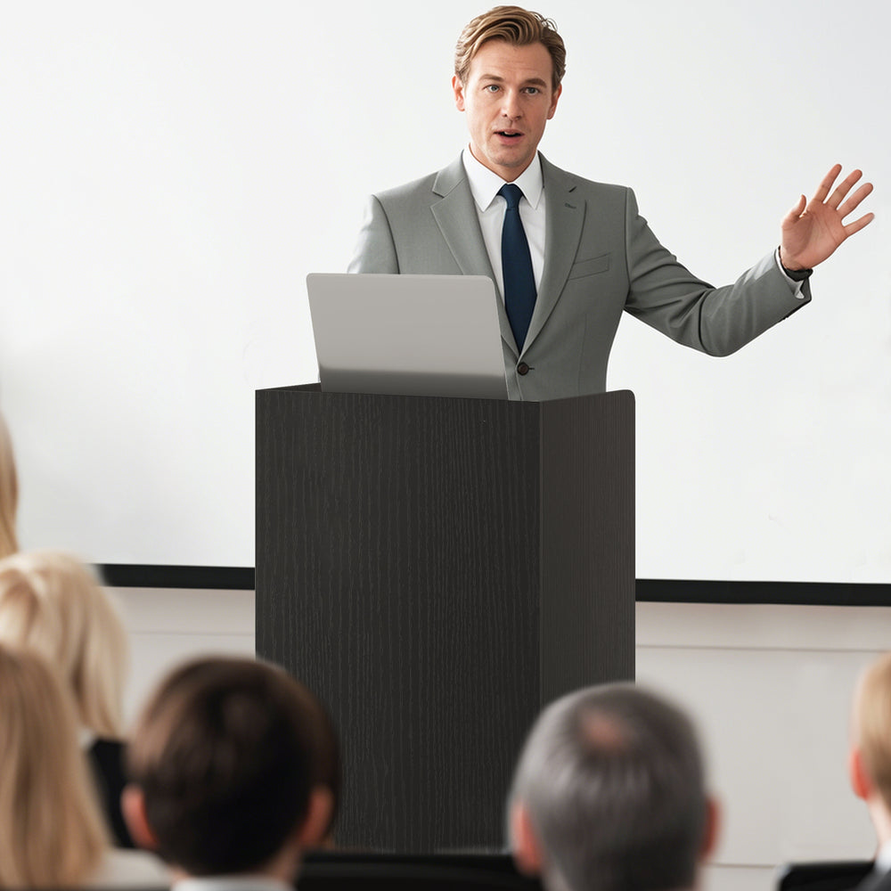 Rolling podium stand with two shelves and lockable wheels, ideal for speeches and lectures in modern settings.
