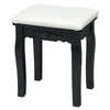 Cushioned stool with black frame, part of a vanity table set, perfect for bedroom or small spaces.