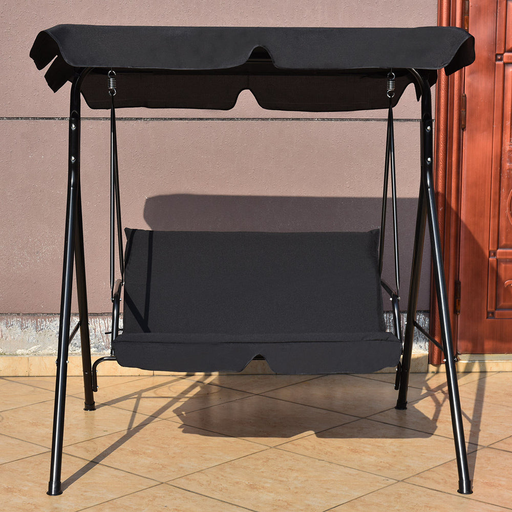 Cushioned black loveseat patio swing glider with waterproof canopy, featuring a sturdy steel frame for outdoor.