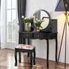 Side view of the black makeup vanity table set showcasing its elegant design, spacious tabletop, and decorative floral.