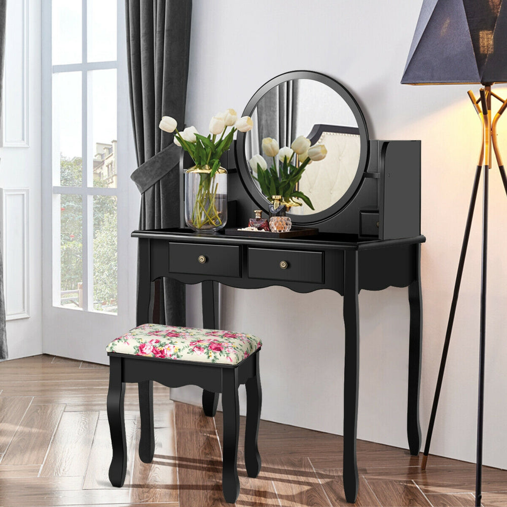 Side view of the black makeup vanity table set showcasing its elegant design, spacious tabletop, and decorative floral.