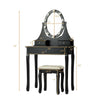Black vanity dressing table set with lighted oval mirror, 3 drawers, and cushioned stool for elegant makeup application.