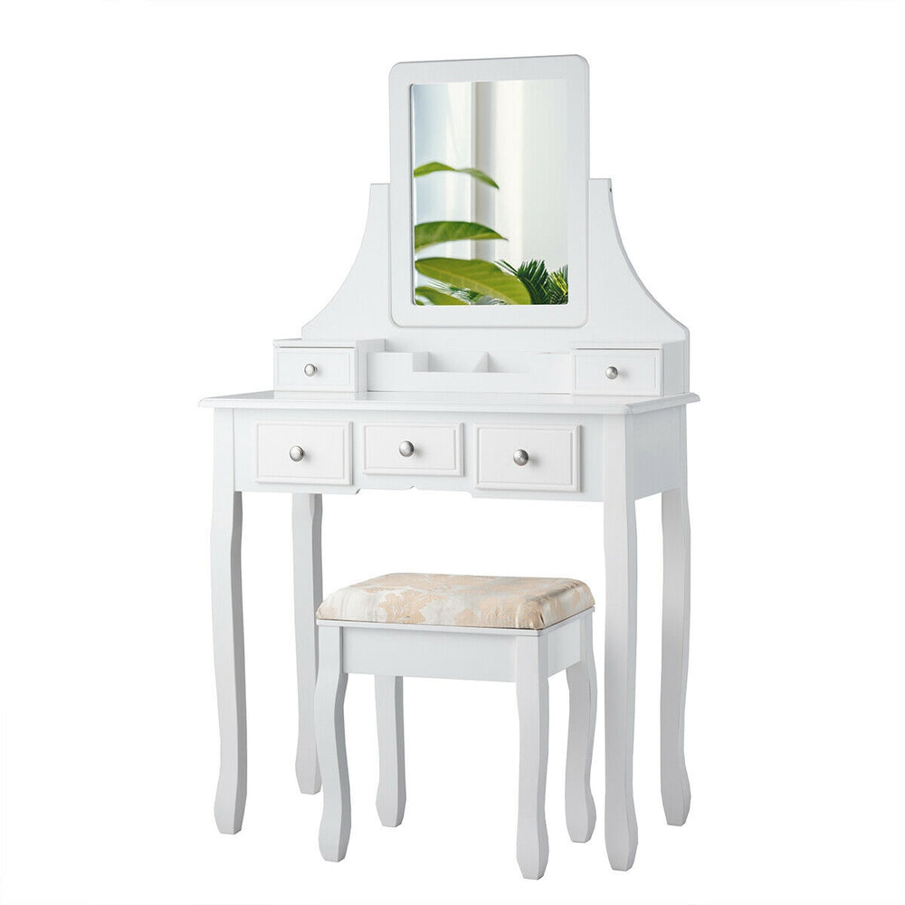 White makeup dressing vanity set with 5 drawers, removable mirror, and padded stool for comfortable use.