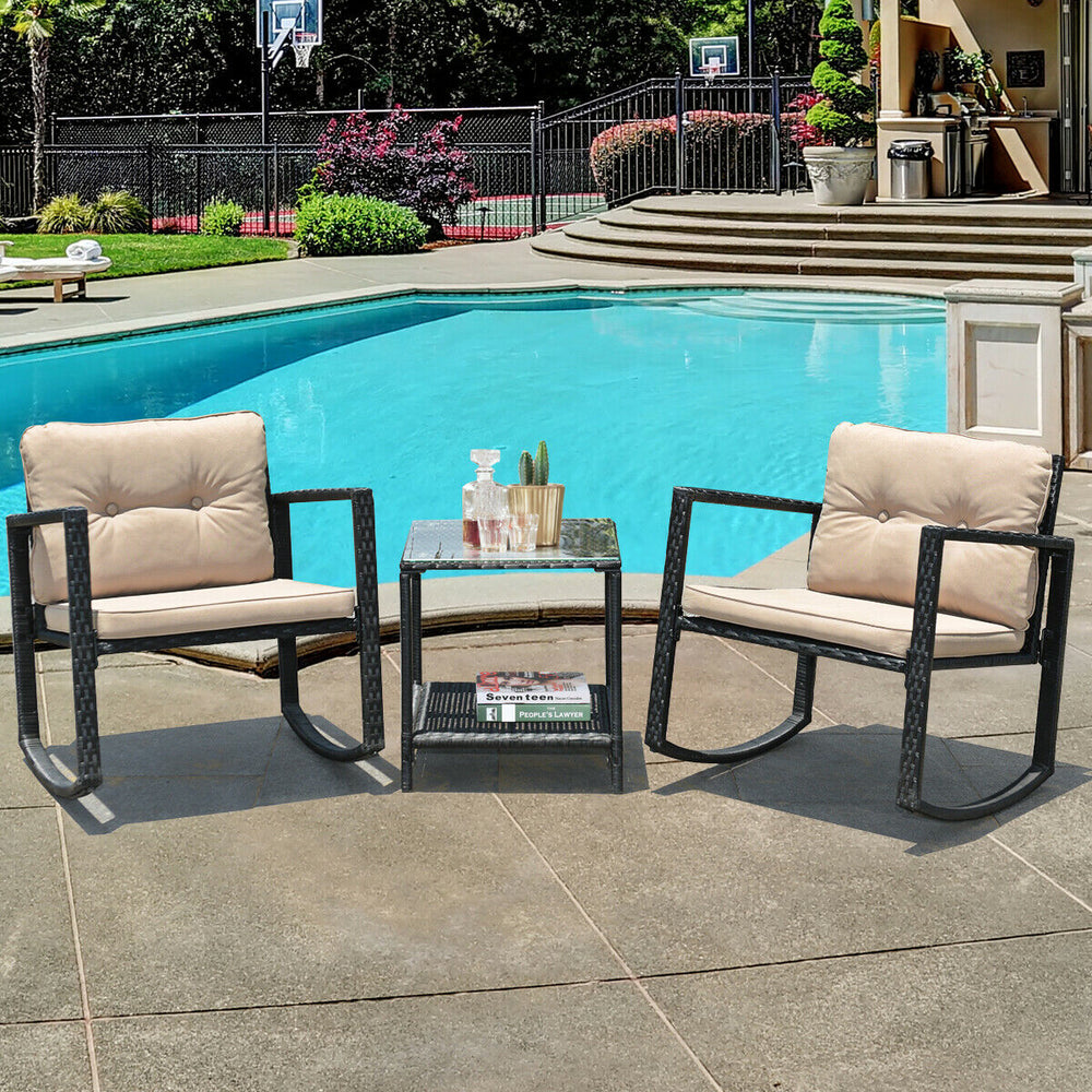 Glass coffee table with lower shelf and two beige rocking chairs, designed for comfort in outdoor settings.