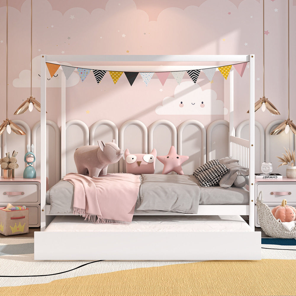 Full size white canopy bed with trundle, solid wood frame, decorated with flags, perfect for kids' bedrooms.