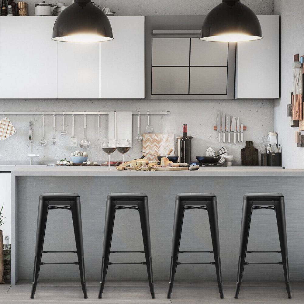 Set of 4 black 30-inch bar stools with square seats and handling holes, perfect for kitchen or home bar use.